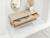 A console table with a drawer and shelf in a hallway setting, next to a mirror and a vase with dried leaves. Produktbild-Vorschau