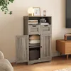 A gray wooden cabinet with doors and drawers open, showing storage space with pillows and baskets. The cabinet is in a room with a chair and a side table. Produktbild-Vorschau