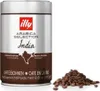 A can of illy Arabica Selection India coffee beans and a pile of coffee beans. Produktbild-Vorschau
