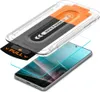 An exploded view of a phone screen protector installation kit, showing the phone, the screen protector, and the installation jig. Náhľad obrázku produktu