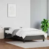 A bed frame with bedding in a room. Náhled obrázku produktu