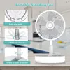 A white portable standing fan is shown on a wooden table with a blurred kitchen background. Callout boxes highlight features like anti-slip pads, 180-degree head rotation, and locking direction. Náhľad obrázku produktu