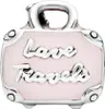 A close-up studio shot of a pink and silver suitcase charm. Anteprima dell’immagine prodotto