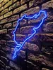 A blue neon sign shaped like a race track is mounted on a brick wall. Náhled obrázku produktu