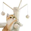A cat is playing with a toy ball attached to a cat tree. Podgląd zdjęcia produktu