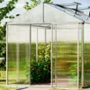 A greenhouse with plants inside, set in a garden. Anteprima dell’immagine prodotto