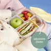 A person holding an open lunchbox filled with food. Anteprima dell’immagine prodotto