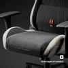 A close-up view of a gaming chair, highlighting its design and comfort features. Produktbild-Vorschau