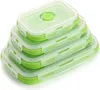 A stack of four green and clear collapsible silicone food storage containers with white lids. Produktbild-Vorschau