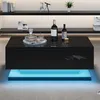 A modern black coffee table with LED lighting underneath, placed in a living room setting. Anteprima dell’immagine prodotto