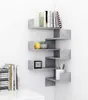 A gray corner shelf unit with books and decorative items. Náhľad obrázku produktu