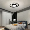 A bedroom with a bed, wardrobe, and desk, featuring a modern ceiling light. Produktbild-Vorschau