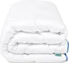 A folded white comforter or duvet is shown against a white background. Produktbild-Vorschau