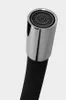 A close-up view of the aerator and end of a black faucet hose. Produktbild-Vorschau