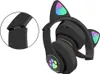 A pair of black wireless headphones with cat ears and LED lights. Náhled obrázku produktu