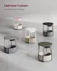 Multiple side tables in different colors are displayed on a light gray floor. Produktbild-Vorschau