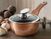 A copper saucepan with a glass lid sits on a wooden surface, with beets and garlic in the background. Náhled obrázku produktu