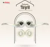 A marketing image showcasing a set of door handles and keyhole escutcheons against a patterned background. Produktbild-Vorschau