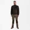 A man is standing and posing in front of a white background, wearing a brown fleece jacket and khaki pants. Produktbild-Vorschau