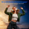 A woman wearing headphones is dancing against a backdrop of a sunset and starry night sky. Produktbild-Vorschau