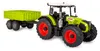 A toy tractor with a trailer, shown from a three-quarter angle on a white background. Produktbild-Vorschau