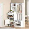 A white entryway organizer with a bench, shoe storage, coat hooks, and shelves, set against a light beige wall. Podgląd zdjęcia produktu