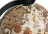A close-up view of a vintage-style globe with a map and illustrations of ships and sea creatures. Anteprima dell’immagine prodotto