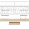 A close-up view of a white metal bunk bed frame with wooden shelves and a keyboard tray. Produktbild-Vorschau