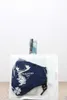 A bottle of gin and a face mask are presented in a clear plastic package. Produktbild-Vorschau
