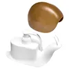 A white snail-shaped soap dispenser with a brown snail shell cover shown separately. Voir les images du produit