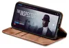 A smartphone in a brown flip case is displayed on a white background, showing a movie poster on its screen. Produktbild-Vorschau