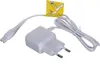 A white power adapter with a cord and a connector for an epilator, along with a yellow instruction sticker. Podgląd zdjęcia produktu