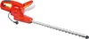 A red electric hedge trimmer is shown against a white background. Náhľad obrázku produktu