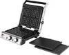 An open waffle maker with removable grill plates next to it. Produktbild-Vorschau
