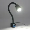 A black LED lamp with a flexible gooseneck and a blue base is shown against a plain gray background. Produktbild-Vorschau