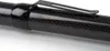 A close-up shot of a carbon fiber fishing net handle with a black clip. Produktbild-Vorschau