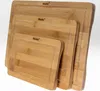 A set of three bamboo cutting boards of varying sizes, stacked diagonally. Produktbild-Vorschau