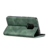 A green flip case for a smartphone is shown standing upright. Produktbild-Vorschau