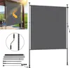 A vertical awning for a balcony or patio, shown in an outdoor setting with sun glare. Produktbild-Vorschau