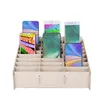A wooden organizer box filled with smartphones, each displaying a different wallpaper. Anteprima dell’immagine prodotto