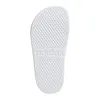 The sole of a white Adidas slipper. Produktbild-Vorschau