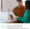 Two people are looking at documents in an office setting with a printer in the background. Podgląd zdjęcia produktu
