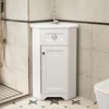 A white corner vanity cabinet with a sink and faucet is shown in a bathroom setting. Náhled obrázku produktu