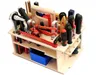 A wooden toolbox filled with various tools, set against a white background. Produktbild-Vorschau