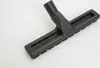 A close-up studio shot of a black vacuum cleaner attachment. Produktbild-Vorschau