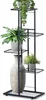 A multi-tiered metal plant stand holding several potted plants and a decorative vase. Náhled obrázku produktu