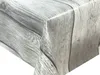 A close-up view of a tablecloth with a wood grain pattern. Produktbild-Vorschau