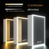 Three illuminated bathroom mirrors are displayed in a dark setting, showcasing different light color temperatures and brightness levels. Podgląd zdjęcia produktu