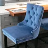 A blue velvet bar stool in a kitchen setting. Produktbild-Vorschau