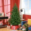 A decorated Christmas tree in a living room setting. Podgląd zdjęcia produktu